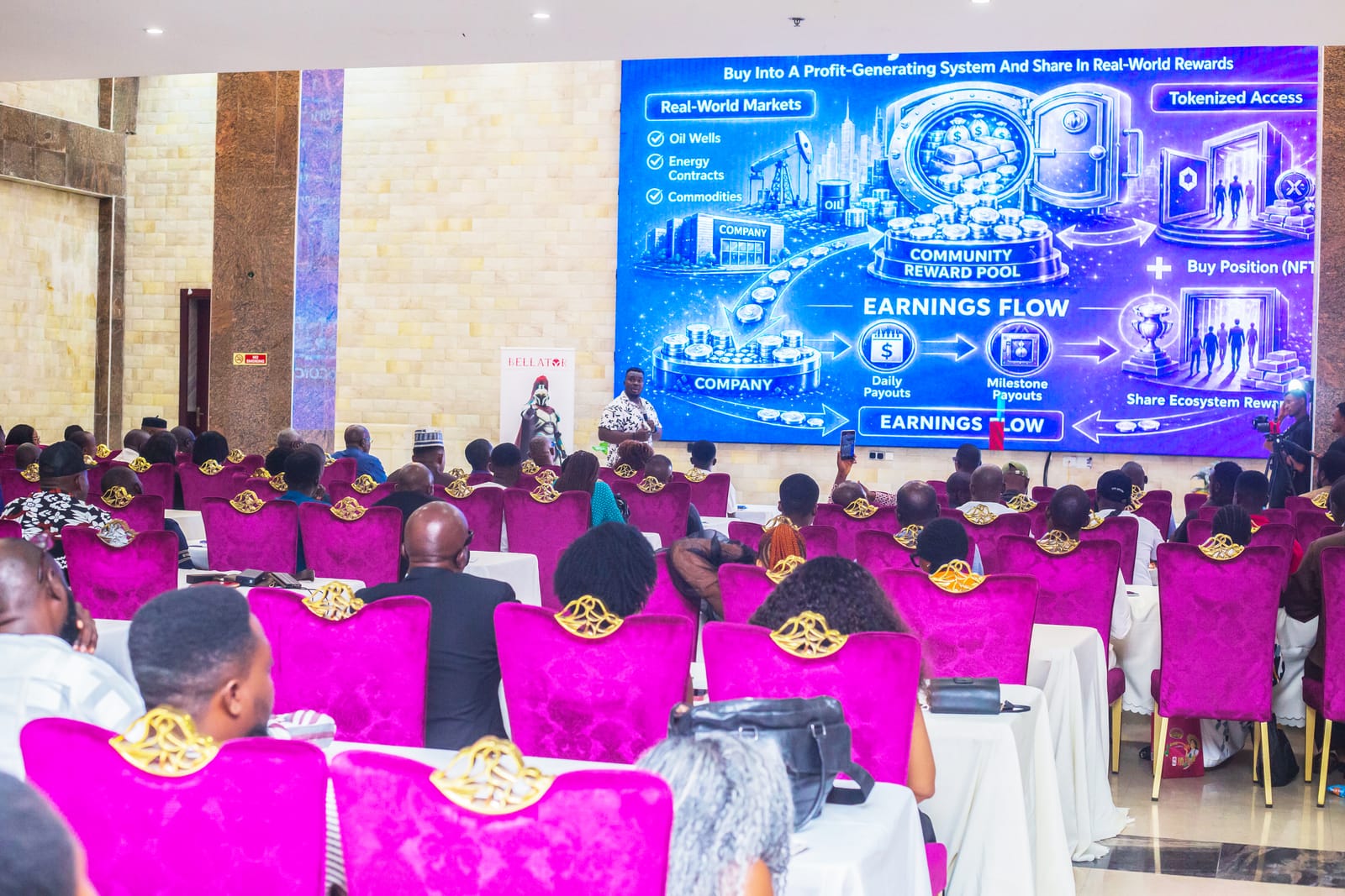 Ken Gideon presenting blockchain education to a full hall